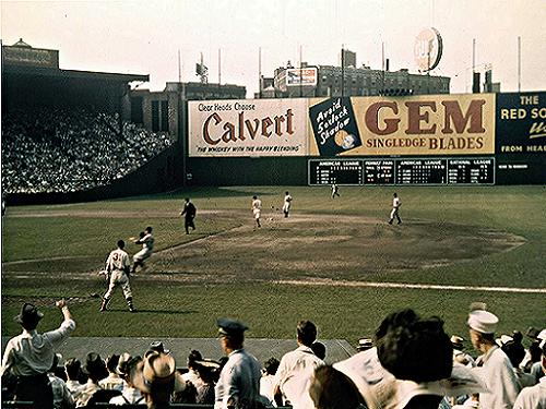 Fenway Park, Boston, MA, July 4, 1947 – Red Sox great Ted Williams in left  field with the freshly painted Green Monster behind him